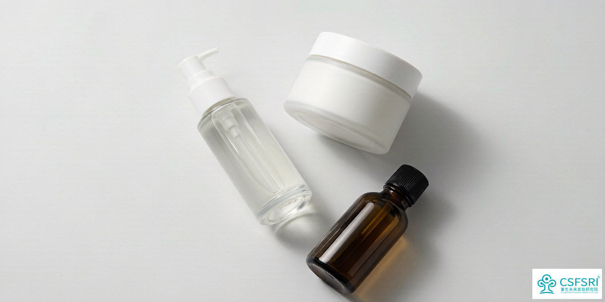 Premium body care product range including a body serum, body lotion and body oil on a clean studio surface