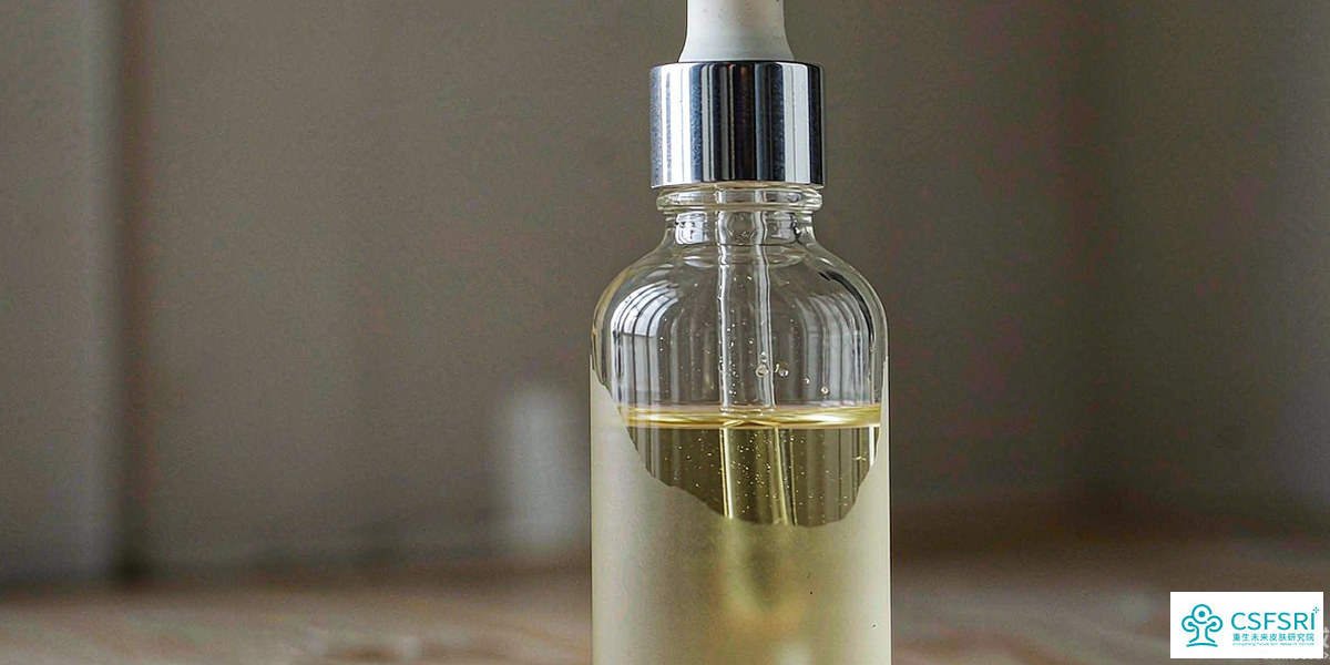 Close-up of a clear oil serum in an unbranded frosted glass bottle under soft studio light